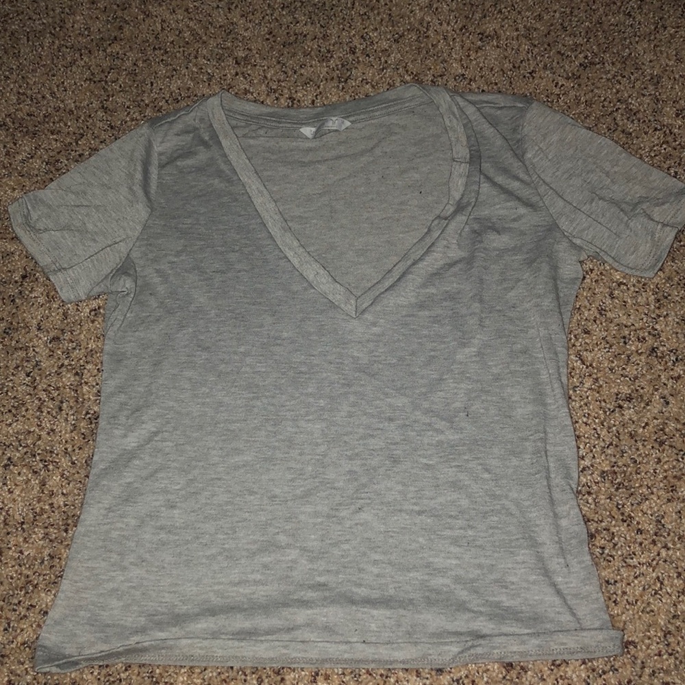 Gray tight fitting crop top.